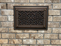 Beaux-Arts dark bronze craftsman style foundation vent installed on brick foundation.  Works with traditional and encapsulated crawl spaces