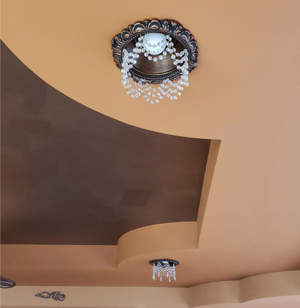 Recessed light trim with crystals in large media room