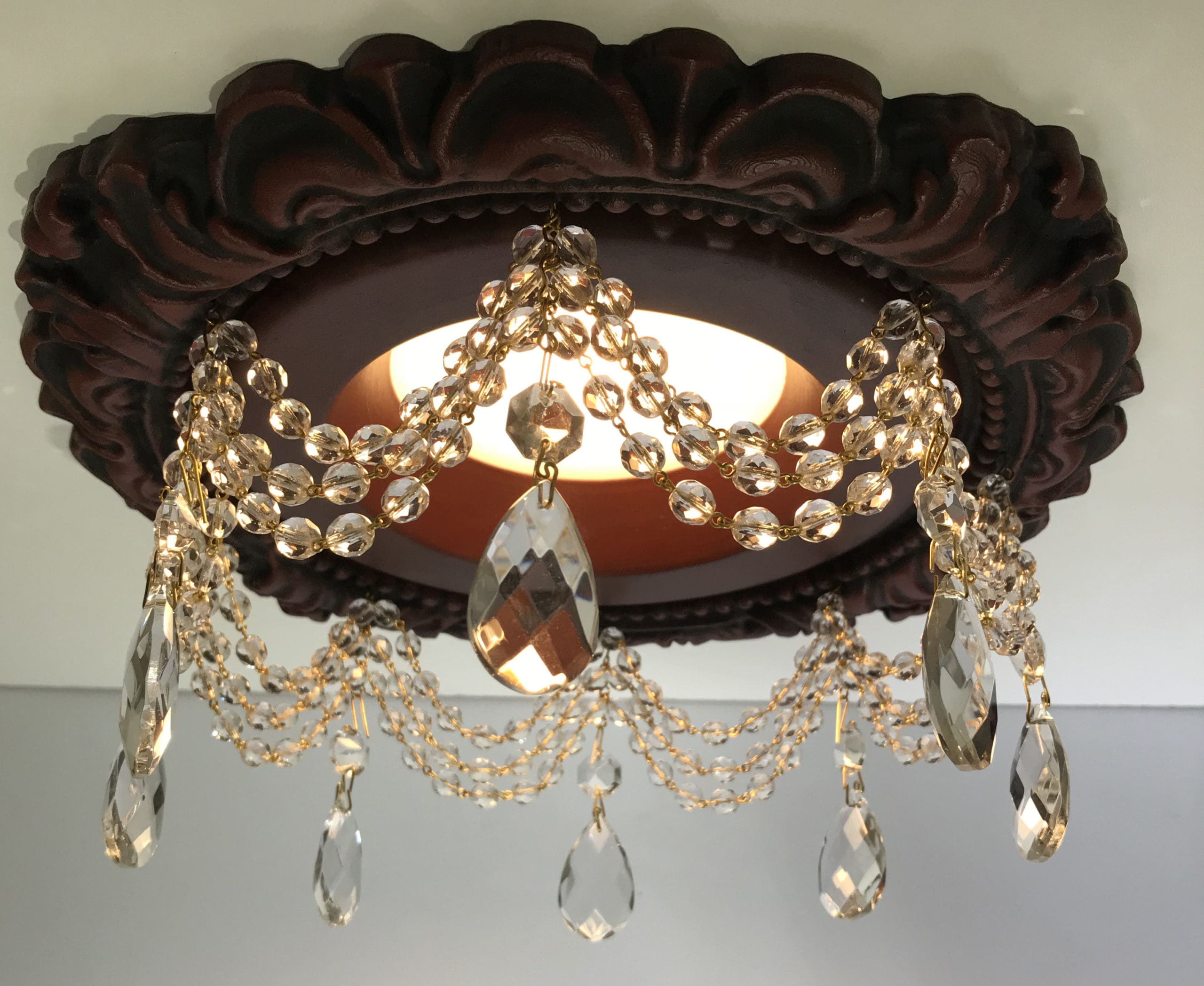 Recessed light trim with 3 swags of clear crystal and 1-1/2" tear drop crystals.