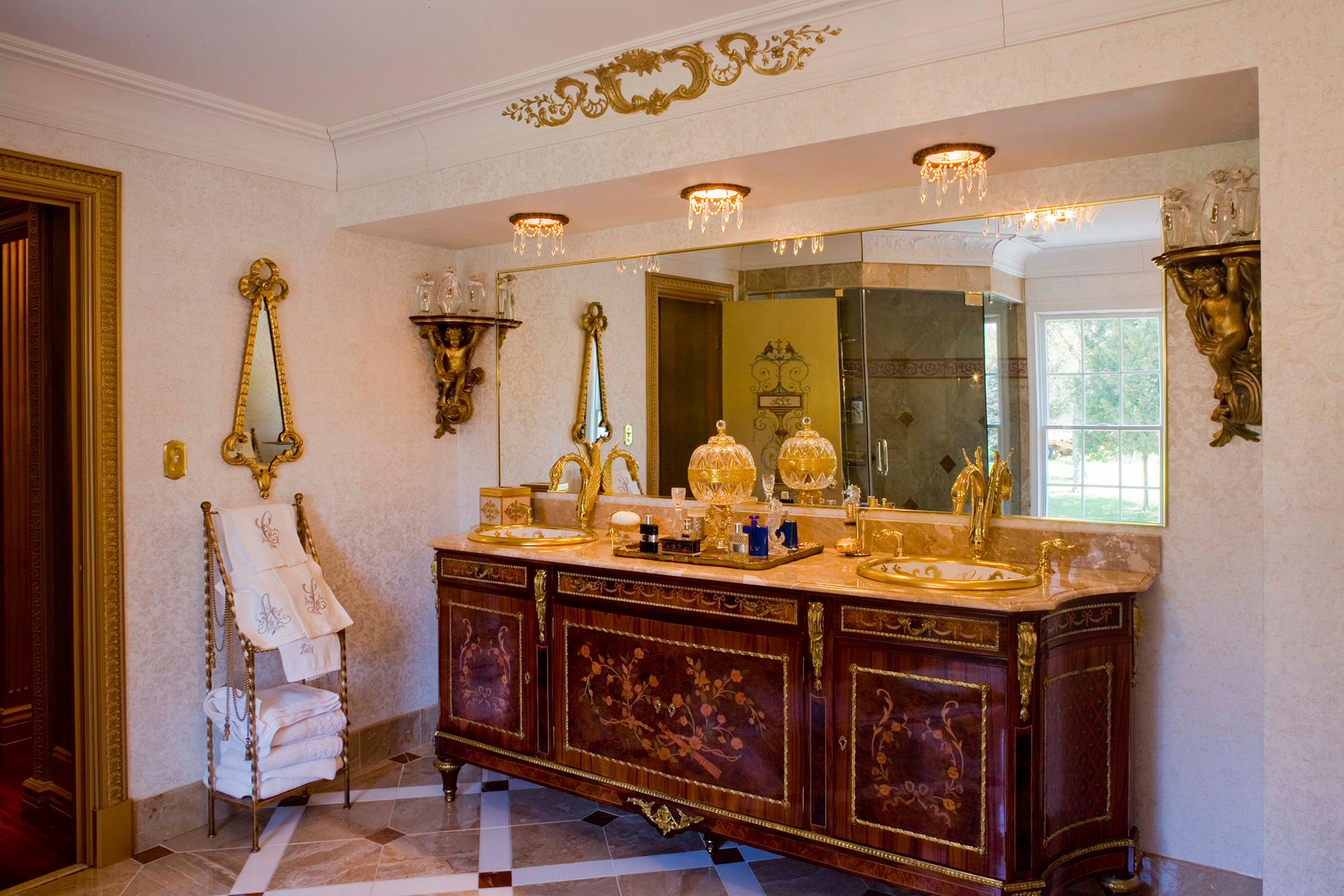 Recessed light trims with crystals are beautiful with the classic vanity in this primary bathroom