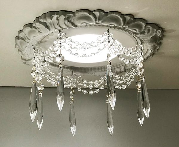 recessed light trim with 3 swags of clear crystal chain and 3" U-Drop crystals.