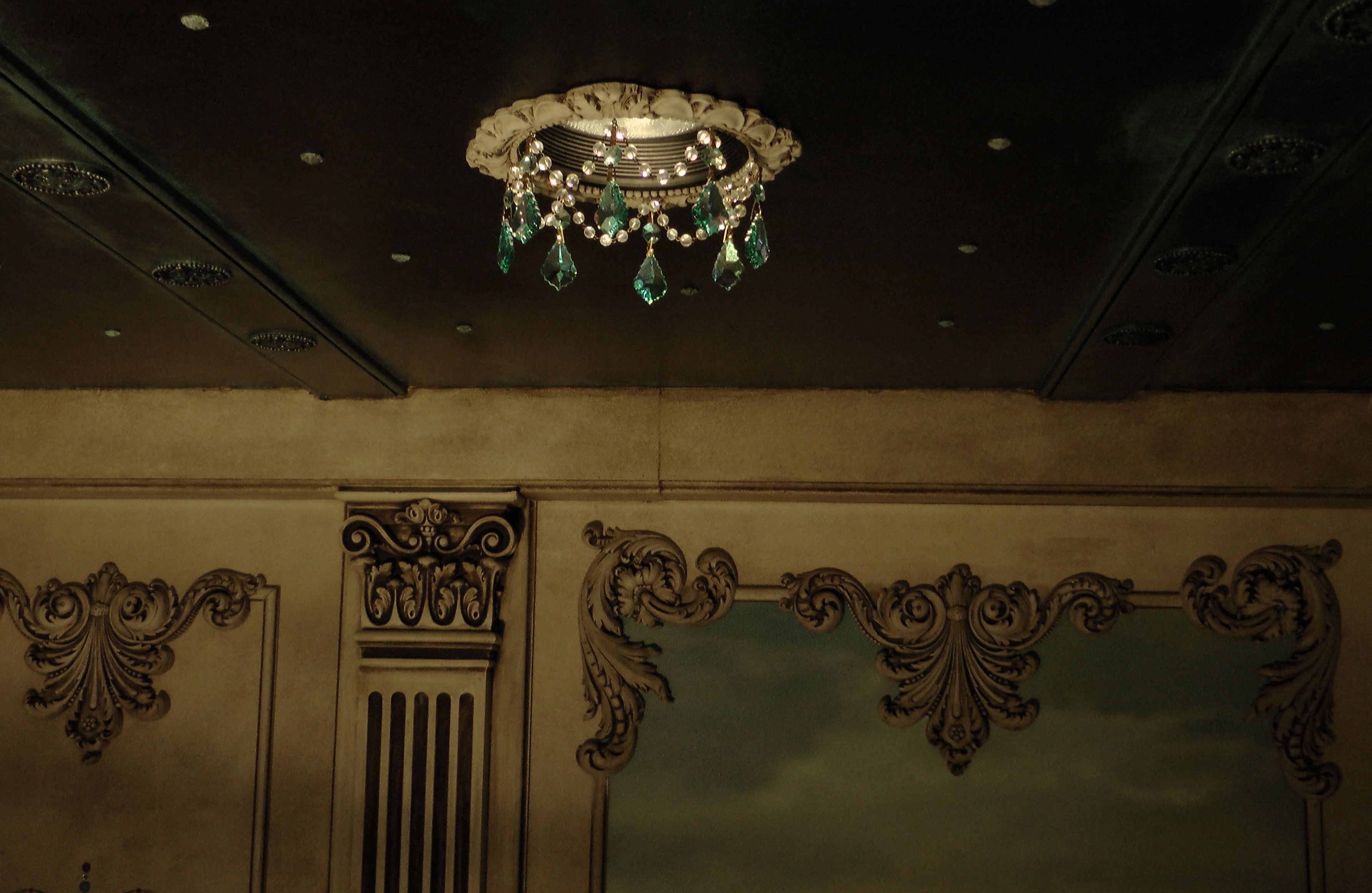 Recessed chandelier with Swarovski green tear drops.