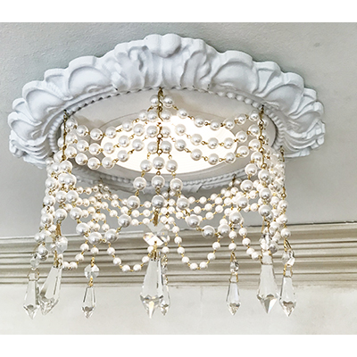 recessed lighting trim with 4 strands of pearl chain and swags with 1.5" U-drop crystals