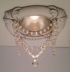 Recessed light trim in Tuscany style with clear crystal chains and swarovski crystal ball