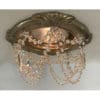 Recessed chandelier with Tuscany style decorative trim with multi strands of crystal chain and clear cut crystal prism