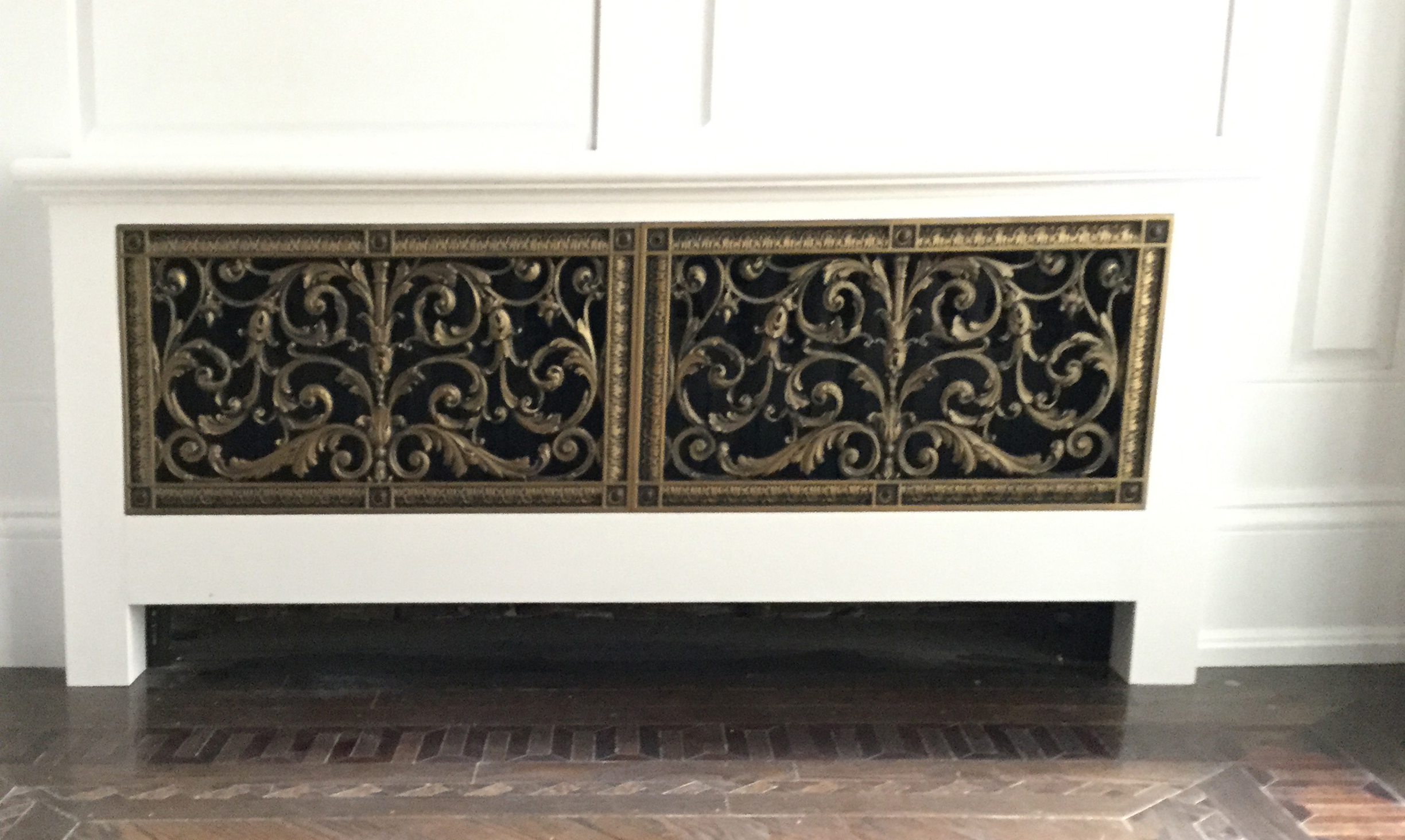 Radiator cover with two Louis XIV Style Grilles installed flush.