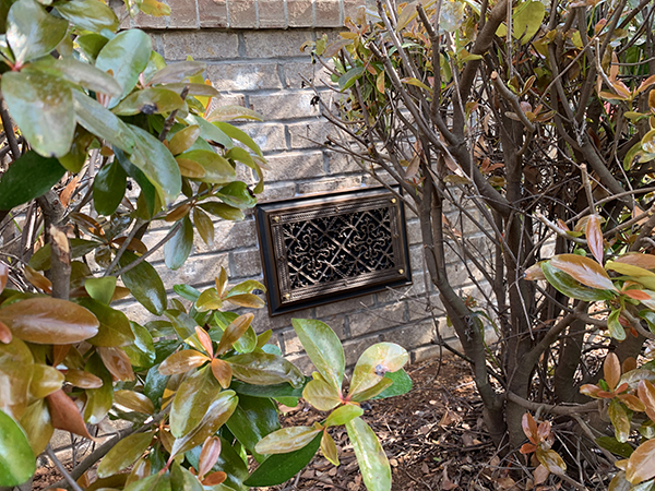 Foundation vent cover in Arts and Crafts style in dark bronze finish.