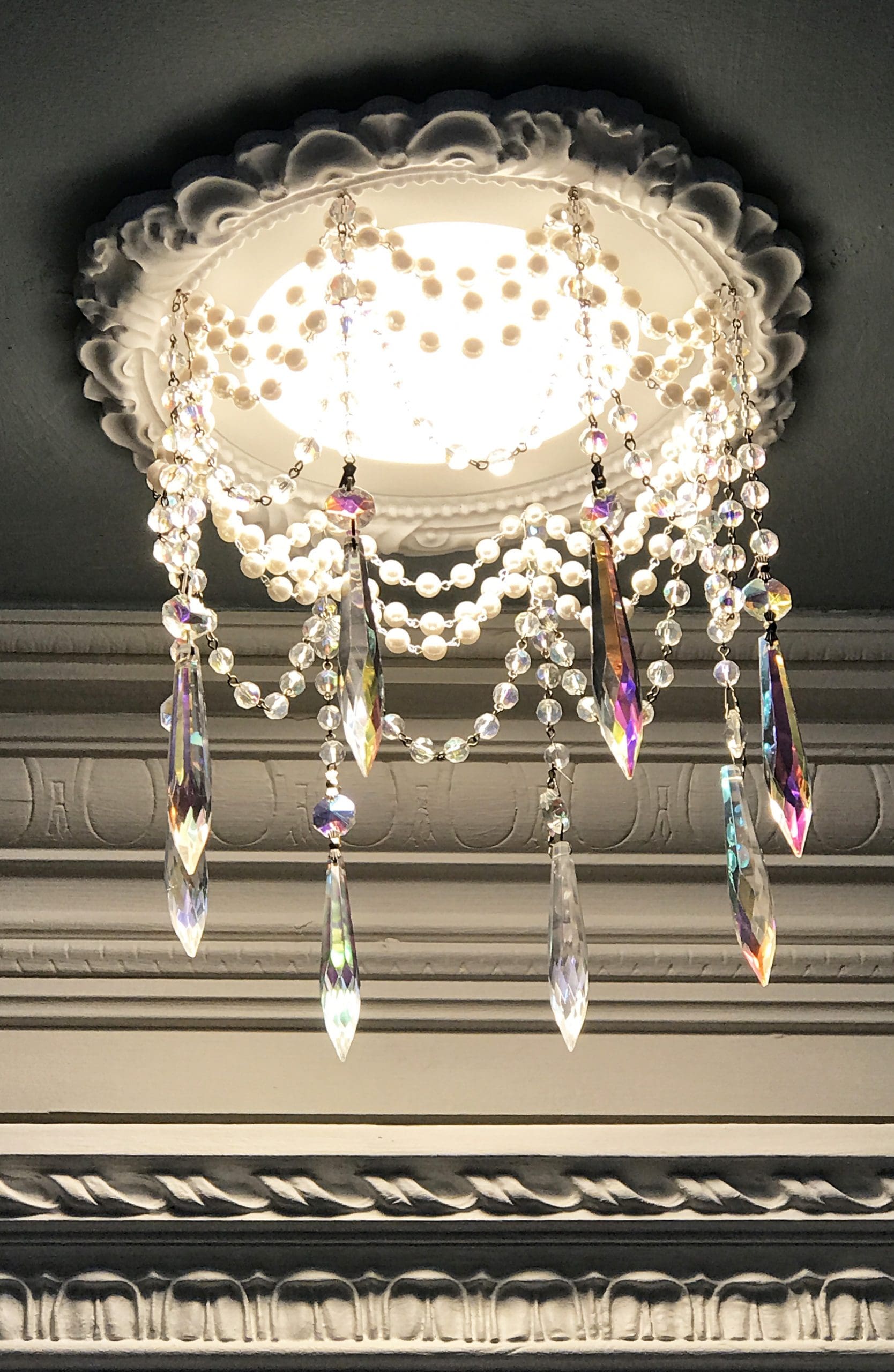 6" LED Recessed Chandelier with 4 strands of pearl and crystal chain.