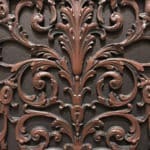 Decorative grille close up of 3-dimensional details of French style Louis XIV in Antique Cherry finish.