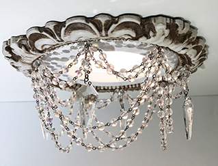 Recessed chandelier with swags,crystal garland and prism cut crystals.