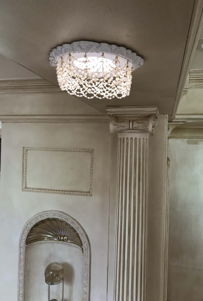 Recessed chandelier with cream pearl swags.