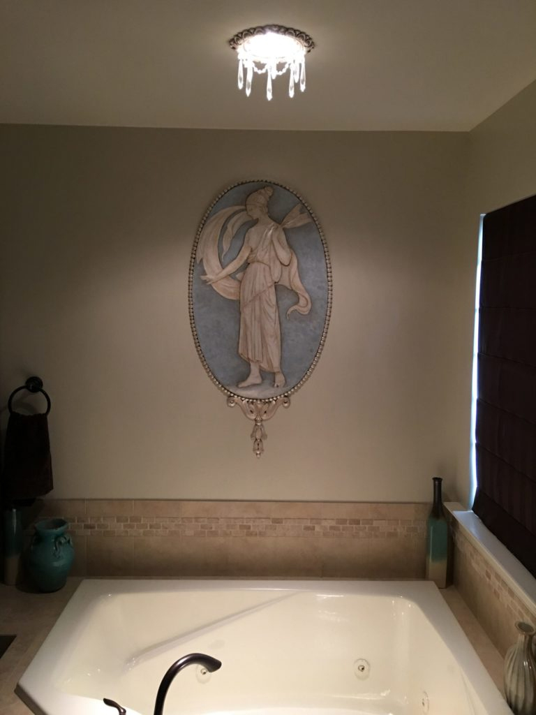 Recessed chandelier over a Master Bath soaking tub.