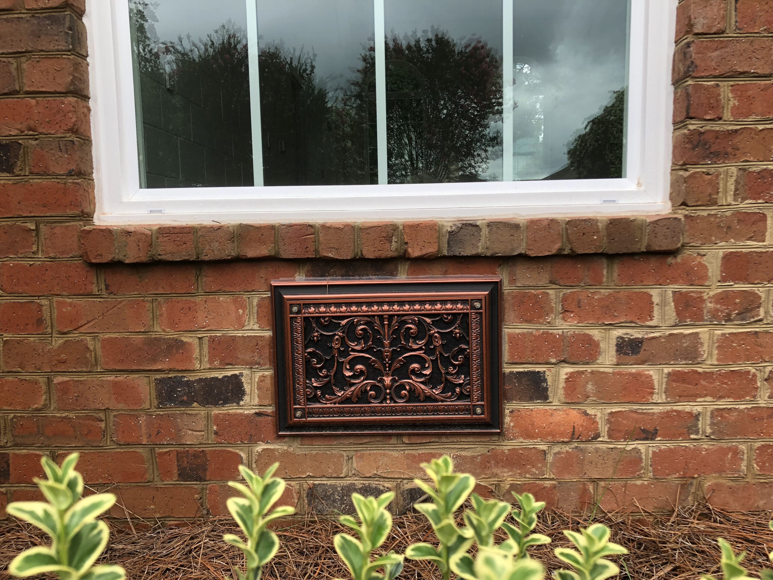Foundation vent cover in french style.